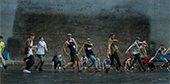 Still image of Hip Hop Choreographer Phillip Cheeb dances in the front row.